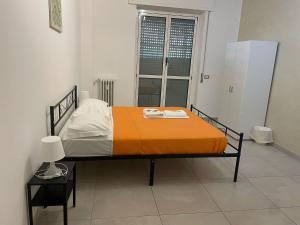 Postel nebo postele na pokoji v ubytování Fiordalisi home