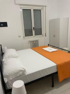 Postel nebo postele na pokoji v ubytování Fiordalisi home