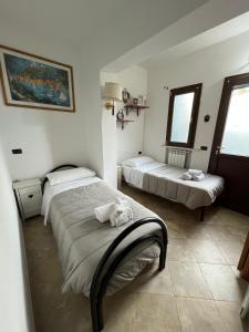 Postel nebo postele na pokoji v ubytování Saturnia Residence