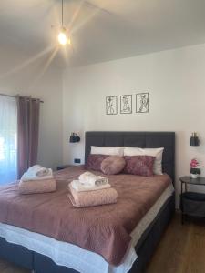 Postel nebo postele na pokoji v ubytování Apartman Harmonija