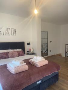 Postel nebo postele na pokoji v ubytování Apartman Harmonija