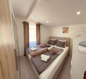 a bedroom with a large bed with two pillows at Vila Neyra in Pula +88 photos