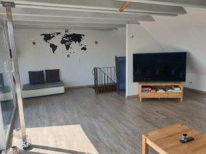 Μια τηλεόραση ή/και κέντρο ψυχαγωγίας στο Feriendomicil am Warener Hafen Casita Priscila