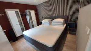 Ένα ή περισσότερα κρεβάτια σε δωμάτιο στο Flint Zuid-Limburg