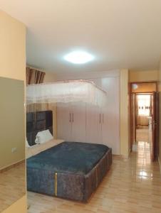 Postel nebo postele na pokoji v ubytování Membly Home