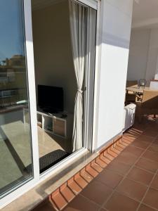 Telewizja i/lub zestaw kina domowego w obiekcie Tenerife PLAYA LA ARENA