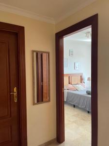 Łóżko lub łóżka w pokoju w obiekcie Tenerife PLAYA LA ARENA