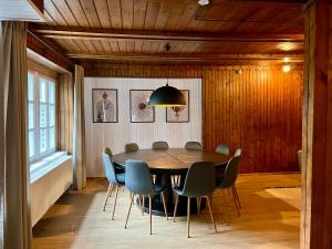 a dining room with a table and chairs at Vila Poilsinė in Balninkai