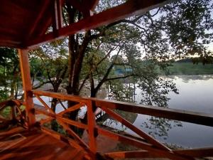 a view of a river from the porch of a house at Chalet del lago Don Asterio in Ciudad del Este