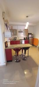 a kitchen with a large table in a room at Beautiful Apartment in Kantaoui Sousse tourist area in Hammam Sousse