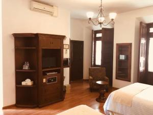 Postel nebo postele na pokoji v ubytování HOTEL MI SOLAR EJECUTIVO