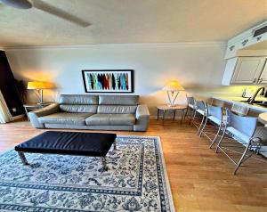 a living room with a couch and a table at Vacation in Comfort and luxury - 1 BR Direct Oceanfront Wyndham Ocean Walk 1505 in Daytona Beach