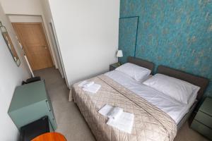 Tempat tidur dalam kamar di Kafka Prague rooms