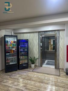 two refrigerators are in a room with aermottermottermott at Hotel Royal Jaraguá in Jaraguá do Sul
