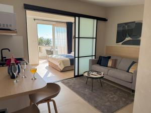 a living room with a couch and a bed at Beach Apartments Ankora in Makarska