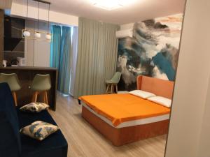 a hotel room with a bed and a couch at HF - Mamaia Nord Building Resort in Mamaia Sat/Năvodari +96 photos
