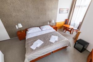 Tempat tidur dalam kamar di Kafka Prague rooms