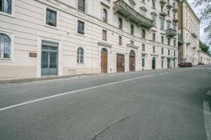 an empty street in front of a large building at AM6 - Dimora del Borgo in Perugia