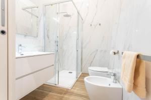 a bathroom with a shower and a sink and a toilet at AM6 - Dimora del Borgo in Perugia