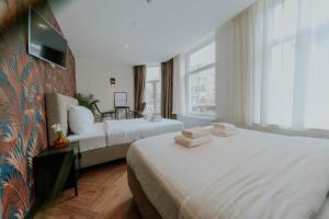 Ένα ή περισσότερα κρεβάτια σε δωμάτιο στο Hotel Heye 130