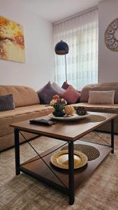 a living room with a coffee table and a couch at Superb 1 bedroom in the best zone of the city. in Ferizaj