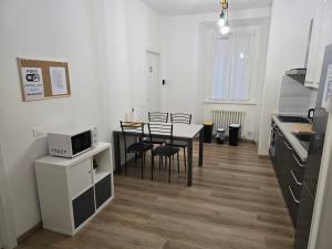 Kuchyň nebo kuchyňský kout v ubytování DA NI TO Rooms 4