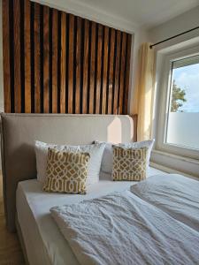 Postel nebo postele na pokoji v ubytování Ferienhaus Dünenweg