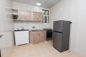 Kuchyň nebo kuchyňský kout v ubytování نسائم صلاله للشقق الفاخرة Nassayem Salalah Downtown