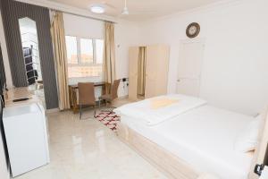 Postel nebo postele na pokoji v ubytování نسائم صلاله للشقق الفاخرة Nassayem Salalah Downtown