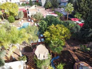 an aerial view of a resort with a pool and trees at Dar Fatna Marrakech in Marrakech
