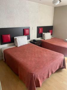 Postel nebo postele na pokoji v ubytování Hotel Colon Express