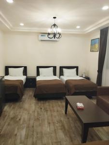 Voodi või voodid majutusasutuse Boutique Living Hotel toas