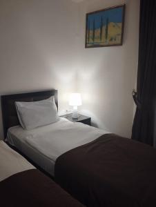 Voodi või voodid majutusasutuse Boutique Living Hotel toas