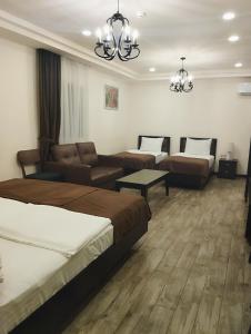 Voodi või voodid majutusasutuse Boutique Living Hotel toas