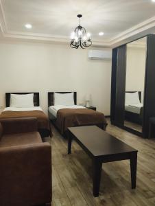 Voodi või voodid majutusasutuse Boutique Living Hotel toas