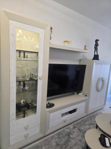 a white entertainment center with a flat screen tv at Mirador del PICO FRENTES in Las Casas +41 photos