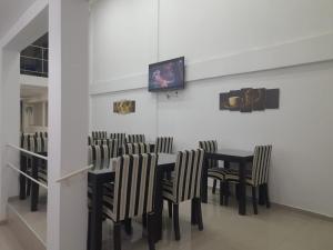 TV a/nebo společenská místnost v ubytování Hotel Emmanuel