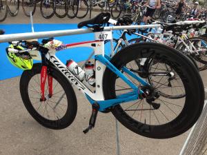 a bike is chained to a rail in a race at Hostal Brisa Marina in Port d'Alcudia