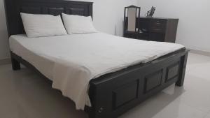 Postel nebo postele na pokoji v ubytování The White House Kandy + 10 fotografií