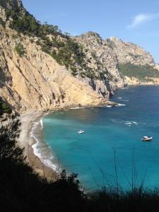 a view of a beach with boats in the water at Hostal Brisa Marina in Port d'Alcudia