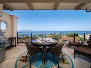 a dining room with a table and a view of the ocean at Totally Revamped Pacific Paradise J505 At Wbv! -Top Floor Ocean Views! in Wailea