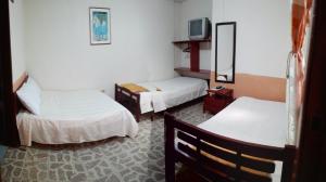 Postel nebo postele na pokoji v ubytování Hotel Alcayata Popayan