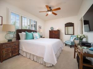 a bedroom with a bed and a ceiling fan at Totally Revamped Pacific Paradise J505 At Wbv! -Top Floor Ocean Views! in Wailea +32 photos