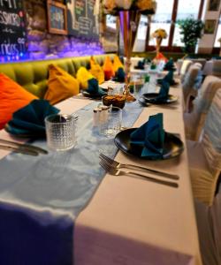 a long table with plates and utensils on it at Brothers Perth City Centre in Perth +56 photos