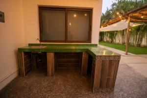a bathroom with a sink and a mirror at Casa Tobala in Acapulco