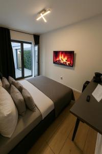 Postel nebo postele na pokoji v ubytování La Suite Hotel & Apartment, Hanau City Centre - Contactless Check-in