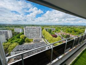 an apartment balcony with a view of a city at Appart meublé 92m2 + 2 terrasses in Brussels