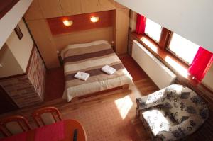 Posteľ alebo postele v izbe v ubytovaní Gyulai Brill Apartman