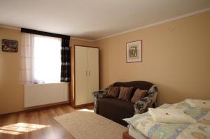 Posteľ alebo postele v izbe v ubytovaní Gyulai Brill Apartman