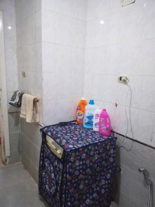 a bathroom with a counter with detergents on it at Gadou Rooms in Port Said